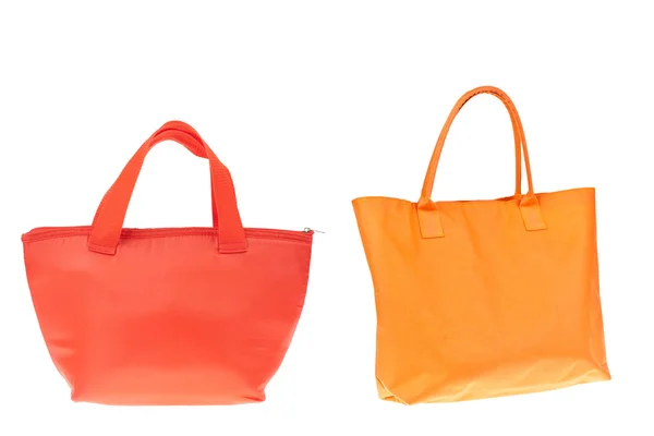 Kolorowe bawełniane pomarańczowe i czerwone torby na na białym tle. — Zdjęcie stockowe