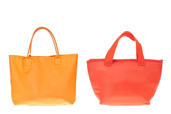 Kolorowe bawełniane pomarańczowe i czerwone torby na na białym tle. — Zdjęcie stockowe
