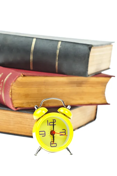 Zegar i książki jako koncepcja zarządzania czas — Zdjęcie stockowe