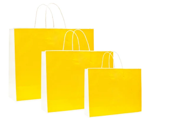 Papieren zakken, gele kleur op witte achtergrond — Stockfoto