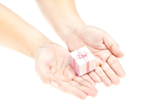 Χέρι και δώρο πάνω από το λευκό φόντο — 图库照片
