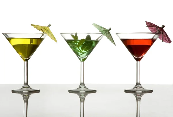 Three cocktails with umbrella — Stock Photo, Image
