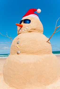 Sandman With Sunnies And Santa Hat clipart