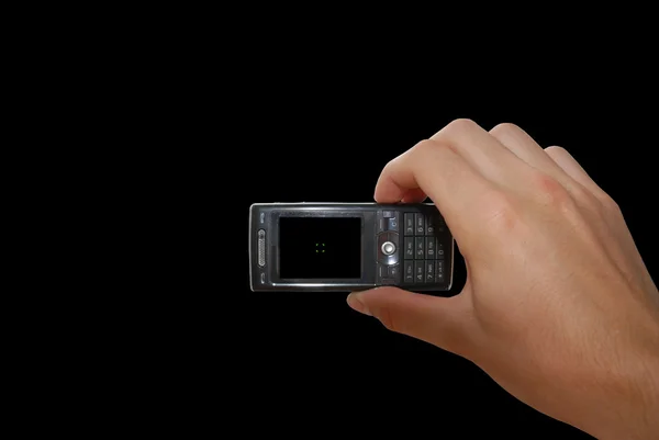 Handy mit Hand auf schwarz — Stockfoto