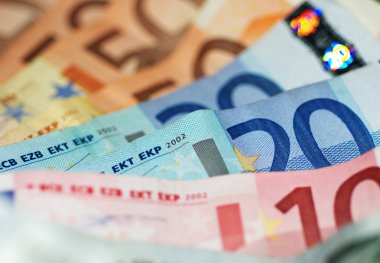 Macro Shot Of Euro Banknotes Focus On 20? clipart