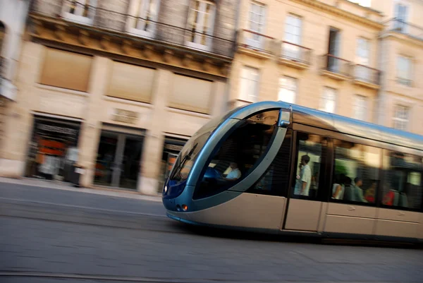 Fast Moving Tram Through Shopping District Captured With Motionblurr — Stock Photo, Image