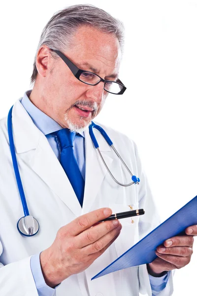 Doctor looking at a case history — Stock Photo, Image