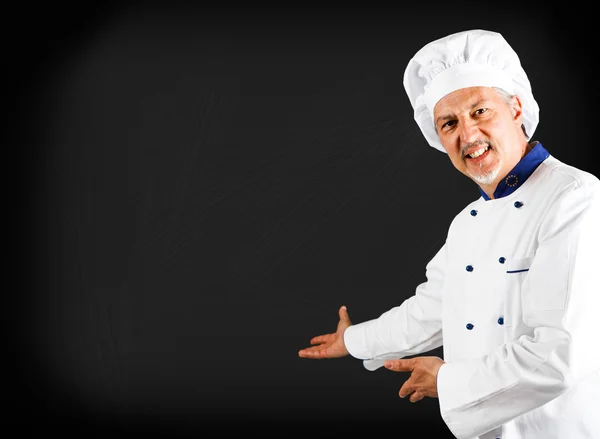 Koch zeigt eine Tafel — Stockfoto
