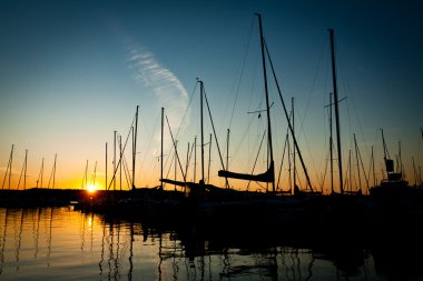 Sunset in luxlury harbour at summer clipart