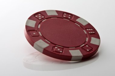 Red chip on white reflection table clipart