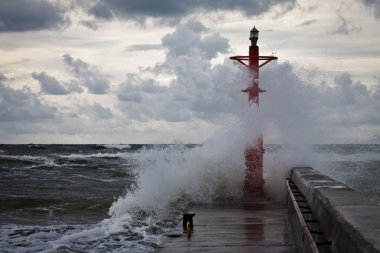 Storm in baltic sea with dynamic clouds clipart