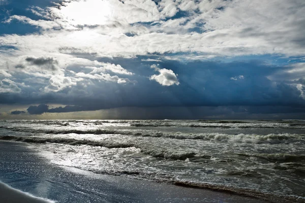 Storm over baltic sea with sunbeam — Stock Photo, Image