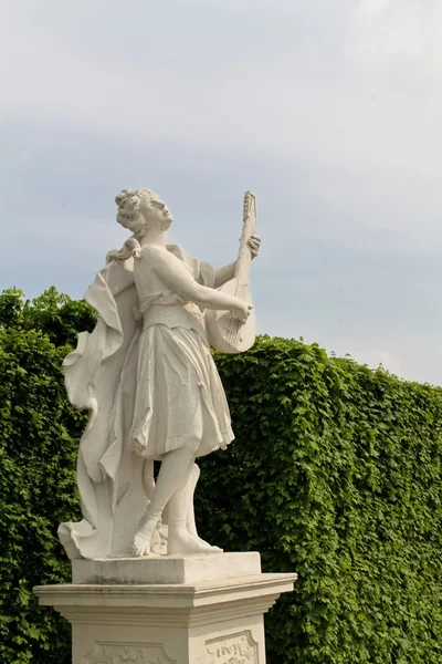 Female statue playing lute — Stock Photo, Image