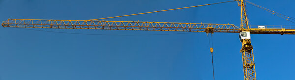 A static yellow crane on a construction site in Vienna, Austria