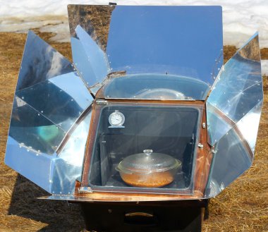 Solar oven in winter clipart