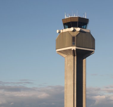 Air traffic control tower above the clouds clipart