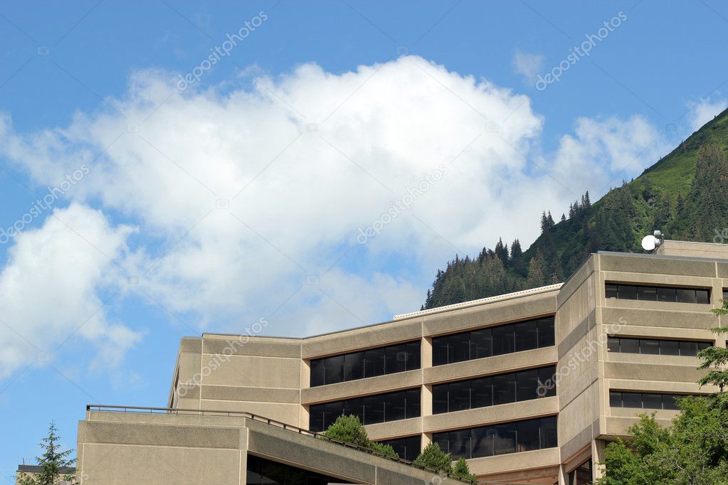 Modern building with puffy clouds