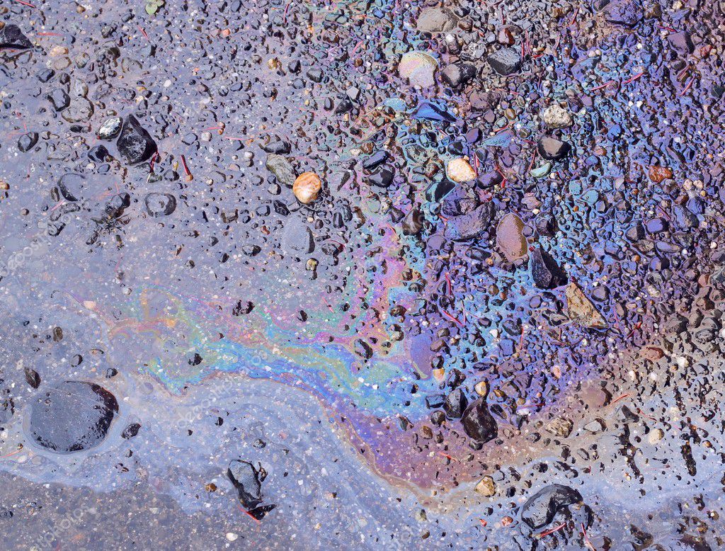 Spilled oil on wet ground — Stock Photo © mcornelius #6695712