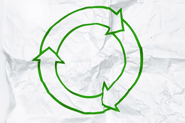 Recycling symbol on white crumpled paper — Stock Photo, Image