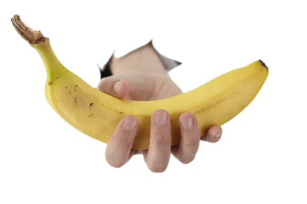 손 구멍에서 바나나를 들고 있다 스톡 이미지