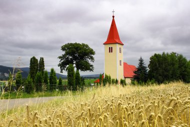 Church in the forefront of grain clipart