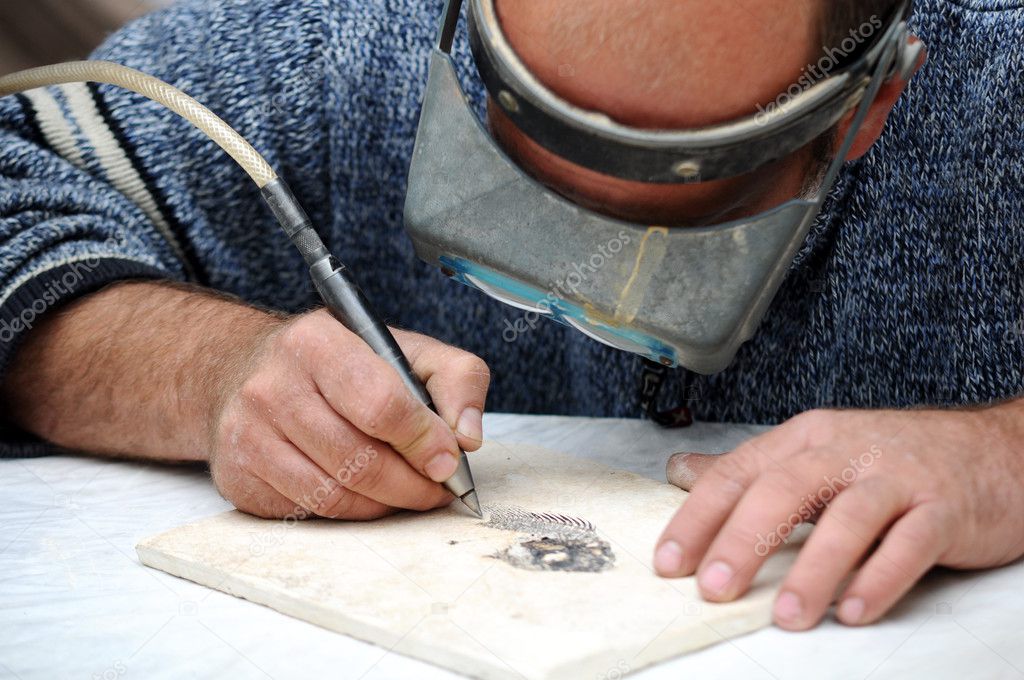 Engraver in stone table