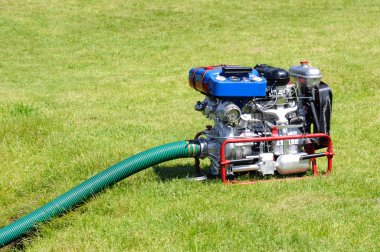 Mobile Fire pump water during exercise, operating on petrol clipart