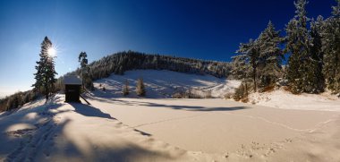 Winter landscape with snow on lake Ottergrund clipart