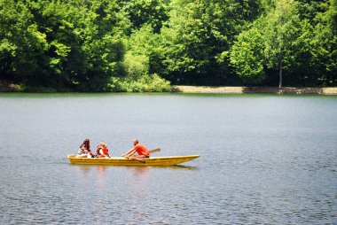 Summer boating on the lake clipart