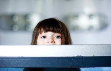 Child girl plays in a bathtub clipart