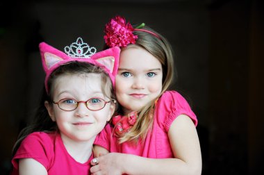 Portrait of two pinky child girls clipart