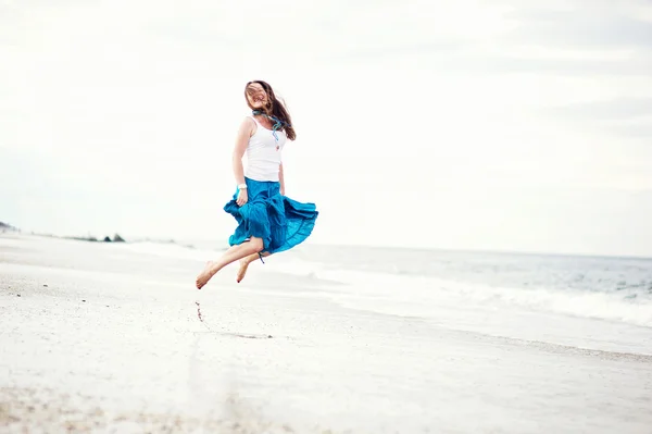 stock image Beautiful young woman has fun on the ocean shore