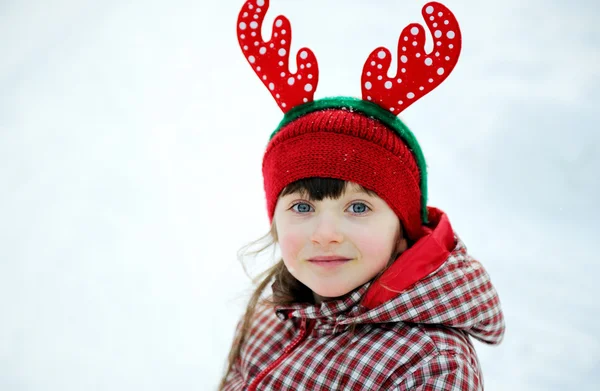 Portrait of adorable child girl in horned hat — Stock Photo, Image