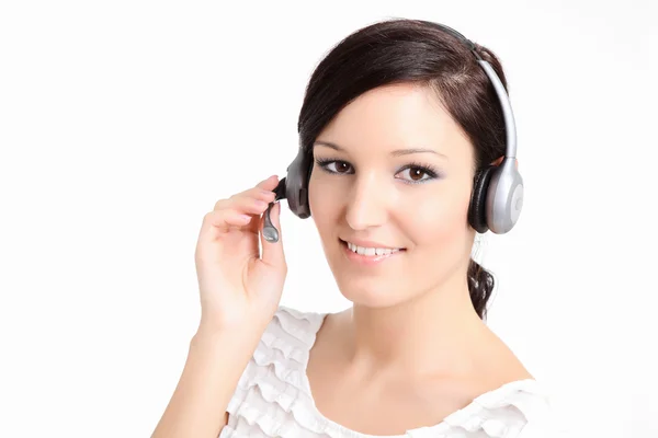 Belas mulheres técnicas de apoio com um fone de ouvido — Fotografia de Stock