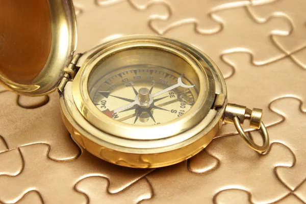 Golden Compass and Puzzle Concept — Stock Photo, Image