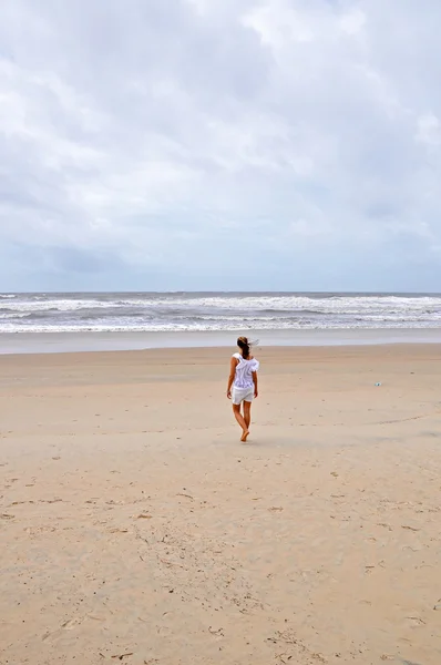 stock image Young Woman on Stormy Beach