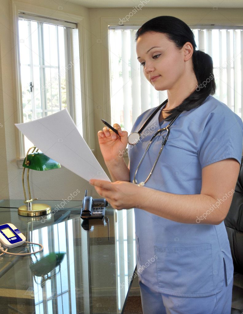 Nurse looking at a medical record