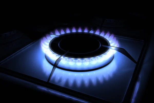 Gas stove burner with blue flame — Stock Photo, Image