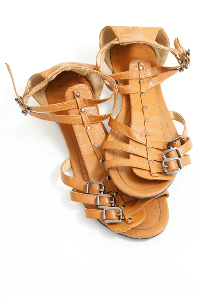 Bruin vrouwelijke sandalen Stockfoto