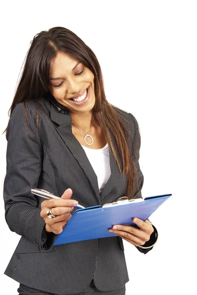 Beautiful brunette woman holding a clipboard — Stock Photo, Image