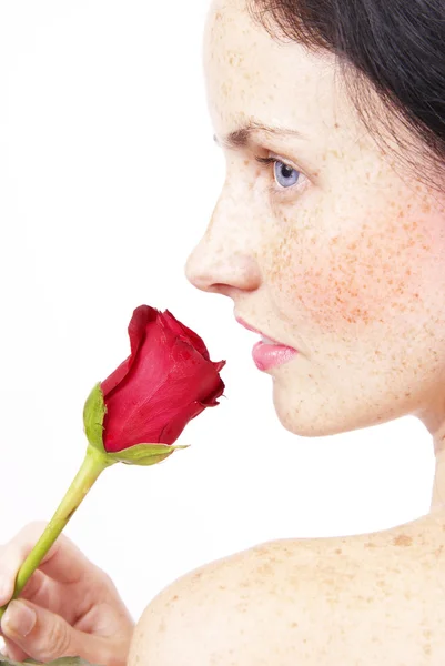Bella donna bruna con una rosa Immagine Stock