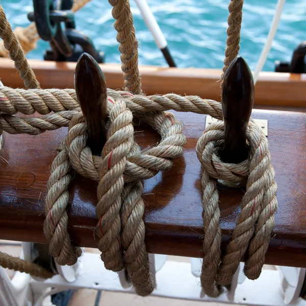 Two ropes control the sails