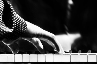 A man playing piano closeup clipart