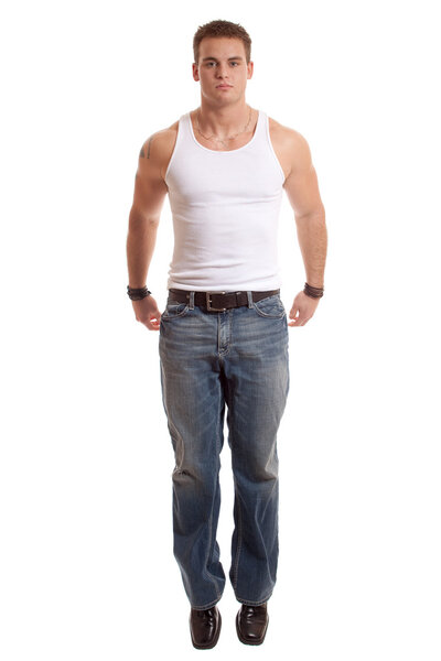 Casual young man in white undershirt and jeans.