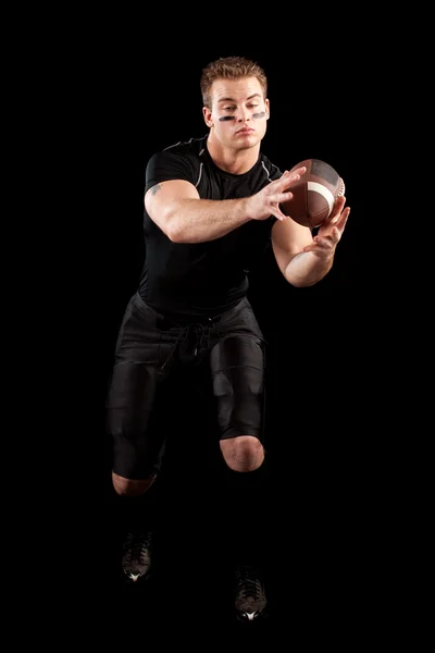 American football player. Studio shot over black. — Stock Photo, Image