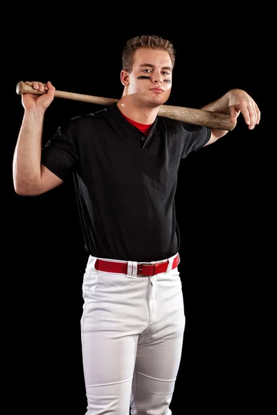 Junge erwachsene Baseballspieler. Studioaufnahme über Schwarz. — Stockfoto