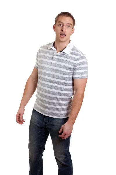 Молодой человек в полосатой рубашке и джинсах. Студия над белым . — стоковое фото