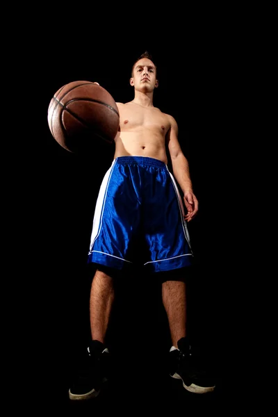 Male basketball player. Studio shot over black. — Stock Photo, Image