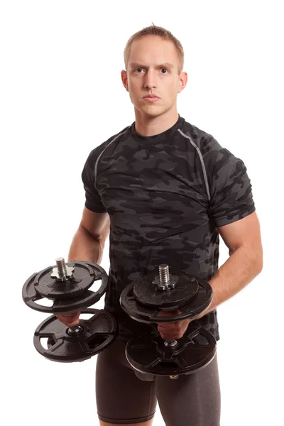 Young man lifting weights. Studio shot over white. — Stock Photo, Image