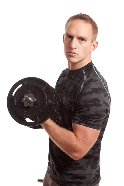 Junger Mann stemmt Gewichte. Studioaufnahme über Weiß. — Stockfoto